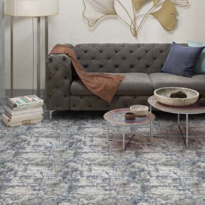 Blue and grey patterned carpet in living room.